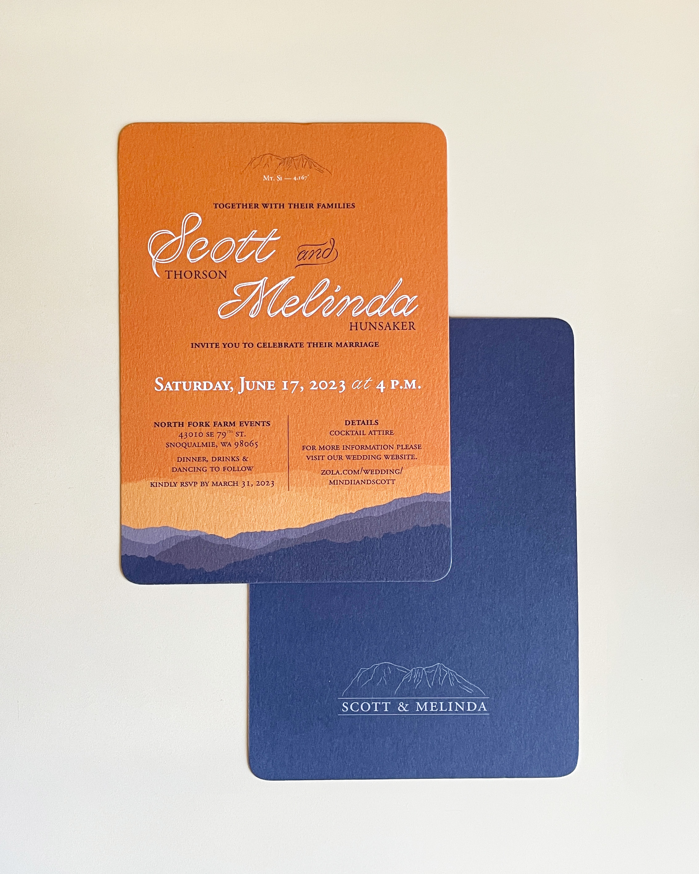 Mt. Si wedding invitation for Scott and Melinda, showing the front and back of the flat card invite. The front is predominantly orange with white lettering, while the back is navy with an illustrated Mt. Si logo.
